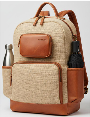 Minimal jute backpack with cognac leather flap pockets and brass-tipped zip pulls, clean studio detail